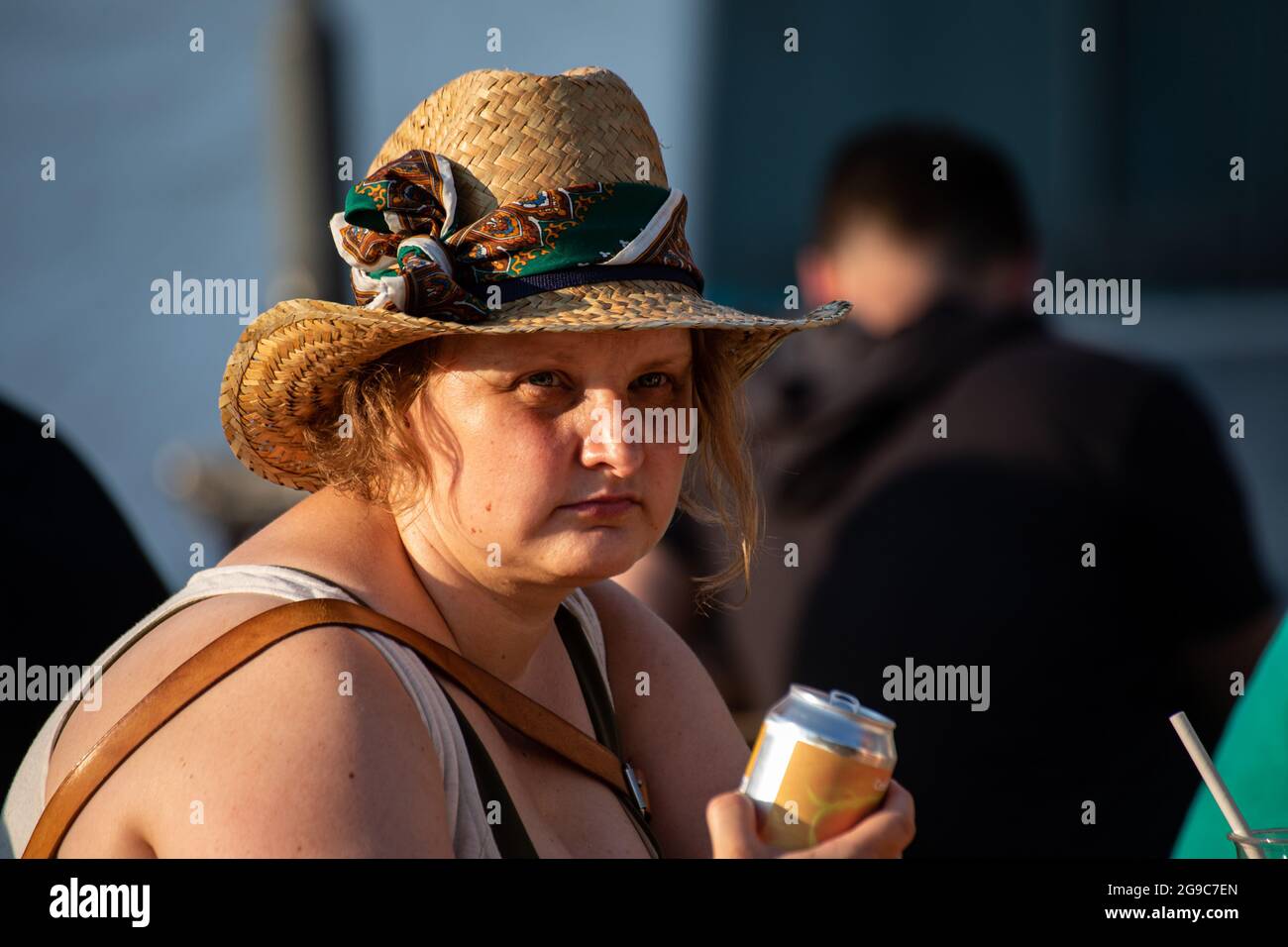 Woman wearing straw hat or summer hat or sun hat Stock Photo