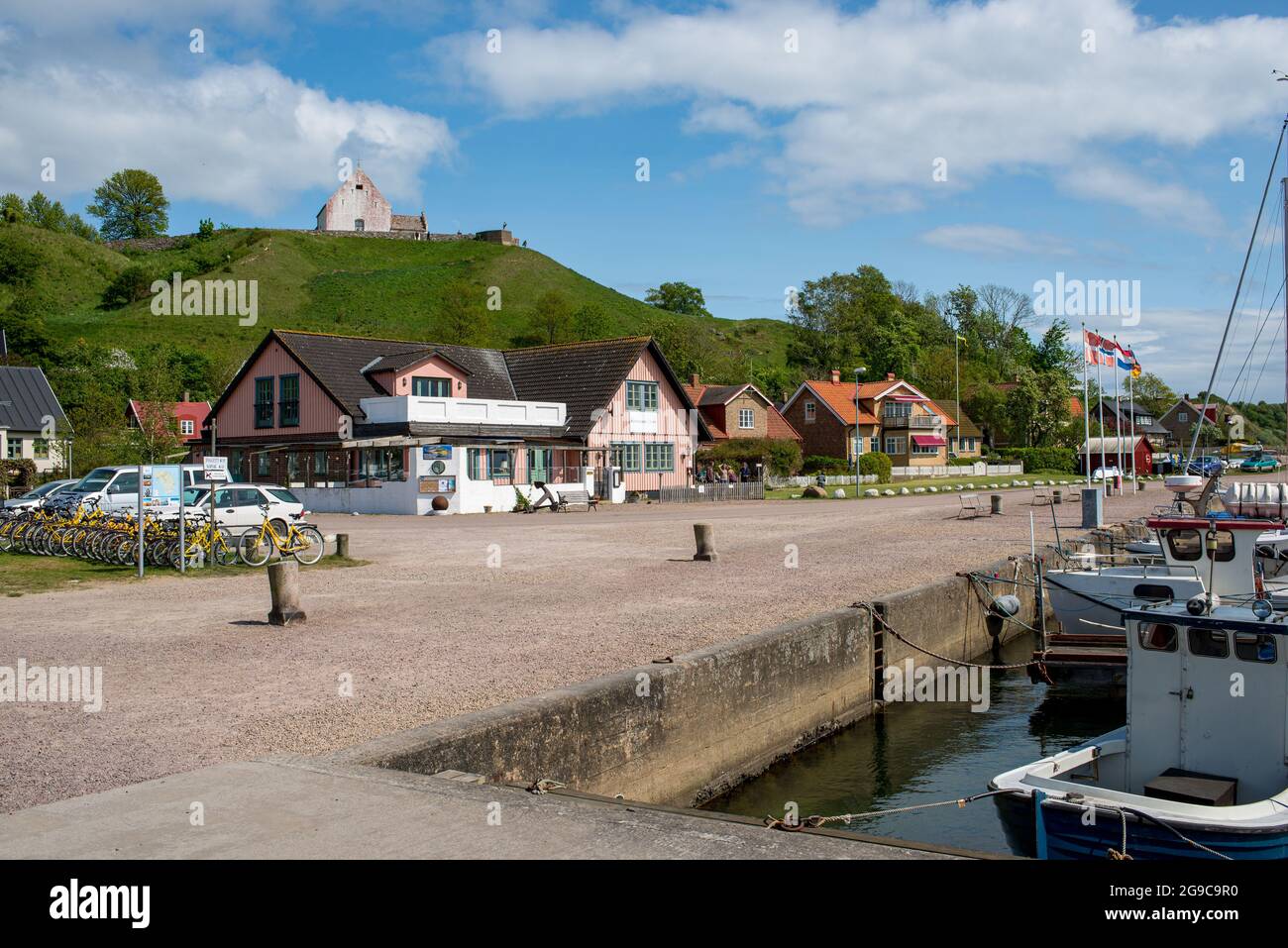 Harbor von Venn with houses and Ibbs Church on Kyrkebacken in the background Stock Photo