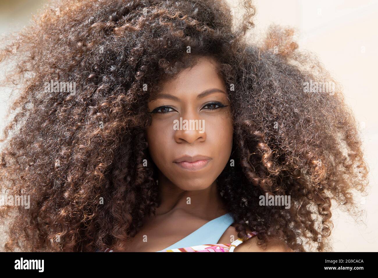 Closeup portrait of young beautiful black woman looking at camera Stock ...