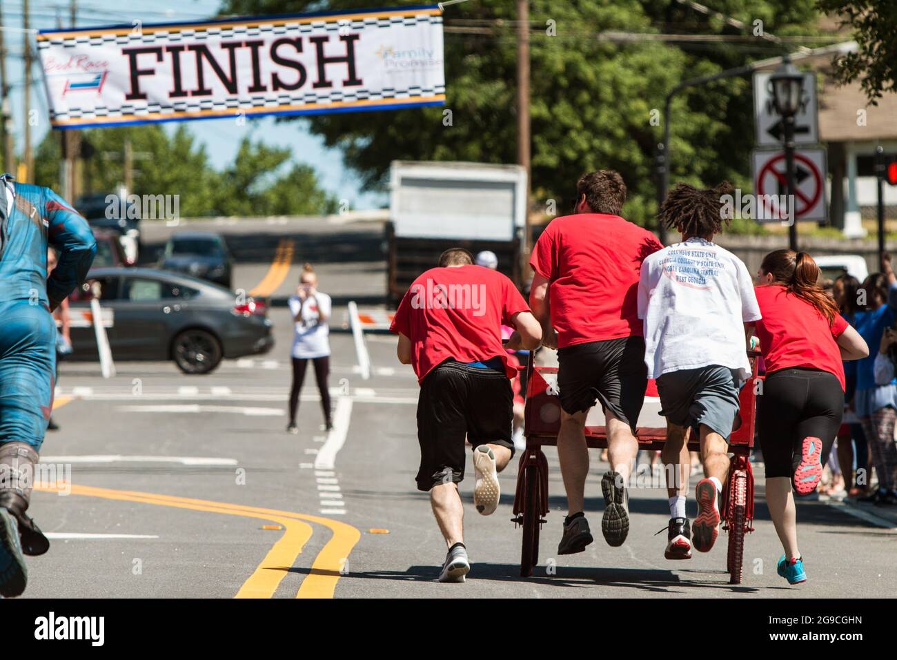 Lawrenceville, GA, USA - April 27, 2019: A team pushes a teammate lying