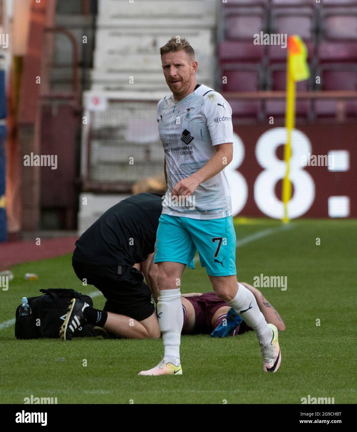 Edinburgh, UK. 25th July, 2021. Premier Sports Cup - Heart of Midlothian v Inverness Caledonian Thistle 25/7/2021. Hearts play host to Inverness Caledonian Thistle in the Premier Sports Cup at tynecastle Park, Edinburgh, Midlothian. Pic shows: Inverness Caley forward, Michael Gardyne, leaves the field after being red carded for a bad foul on Hearts' attacking midfielder, Jamie Walker. Credit: Ian Jacobs/Alamy Live News Stock Photo