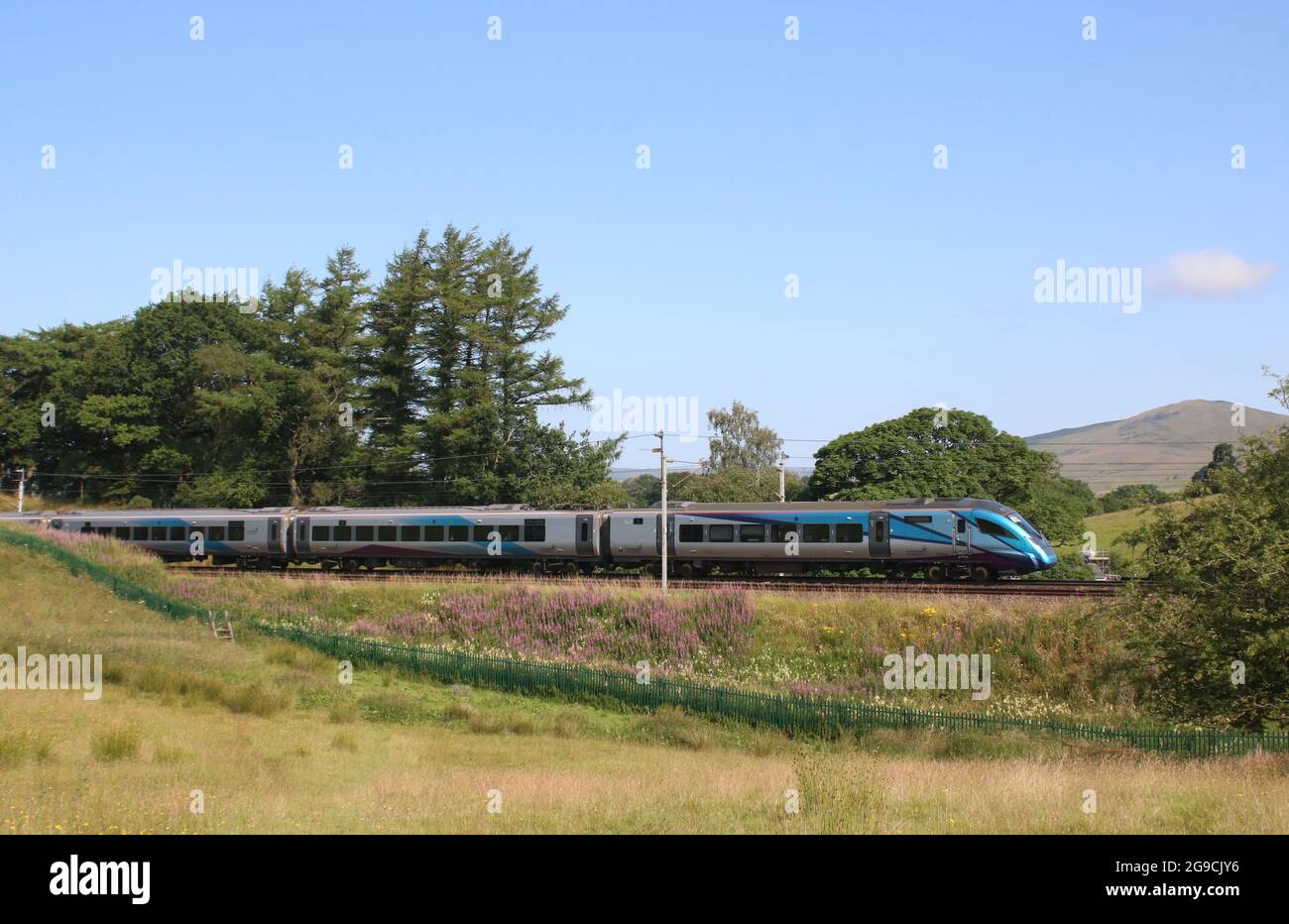 TPE liveried class 397, 397004, passing Grayrigg in Cumbria on the West Coast Main Line on 20th July 2021 with express passenger train to Edinburgh. Stock Photo