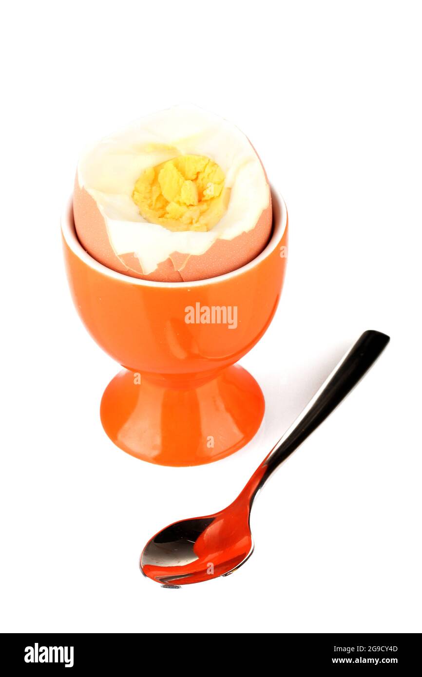 boiled egg in egg cup isolated on white Stock Photo Alamy