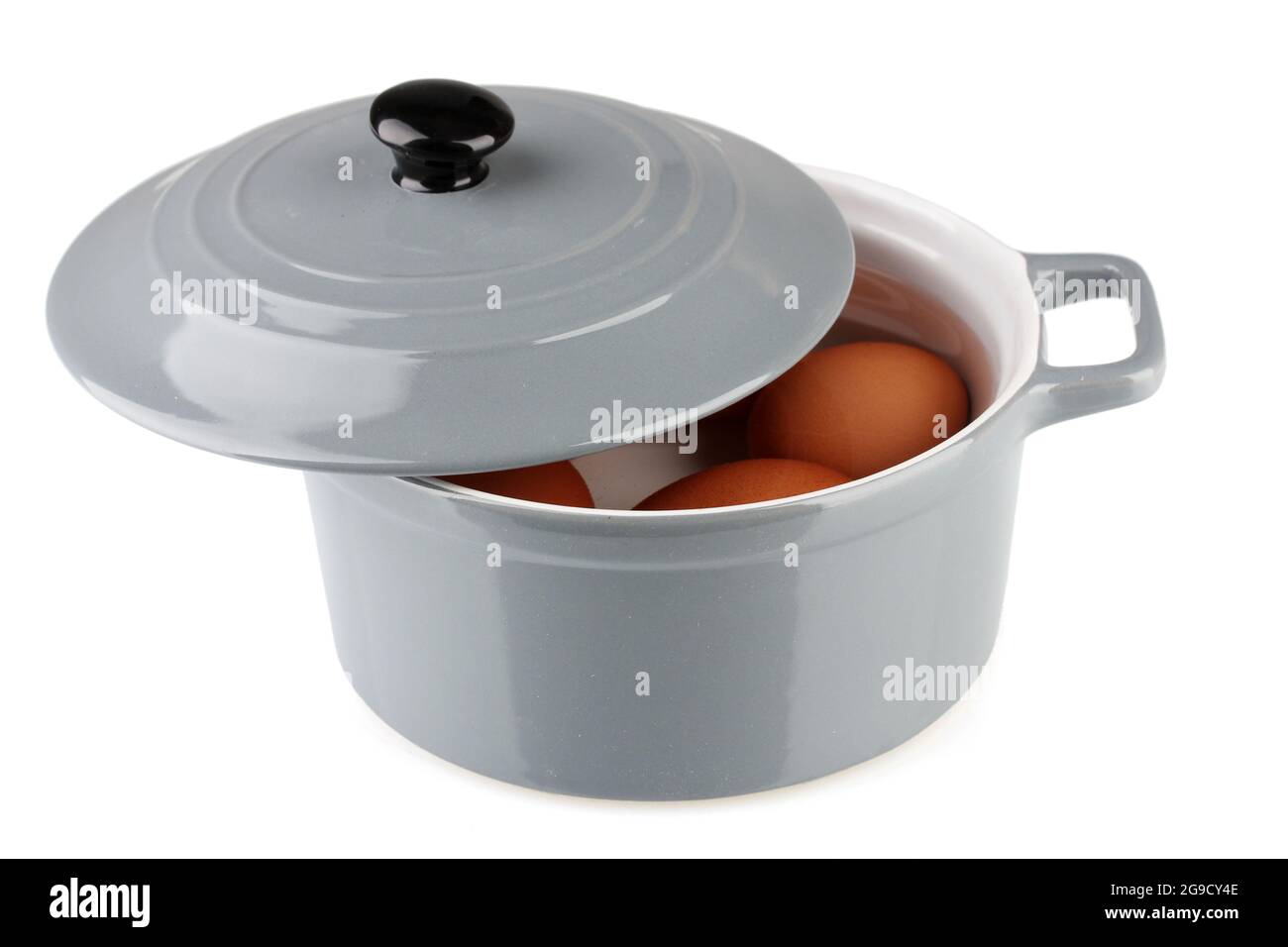 Boiled eggs in saucepan isolated on white Stock Photo Alamy