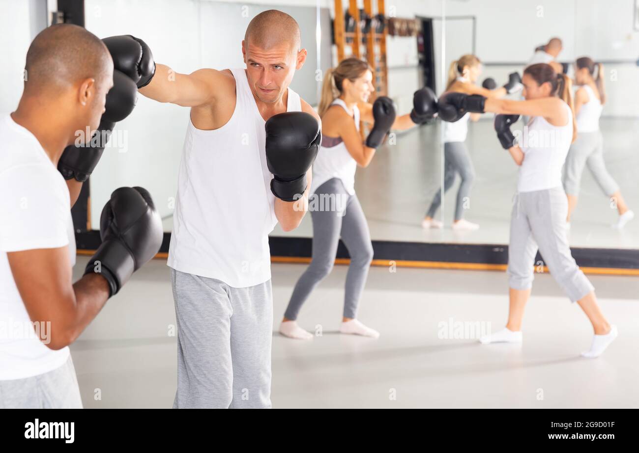 Man practicing punches during sparring at gym Stock Photo Alamy