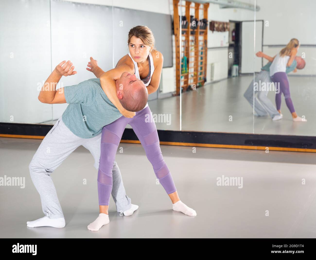 Woman makes choke hold in selfdefense training Stock Photo Alamy
