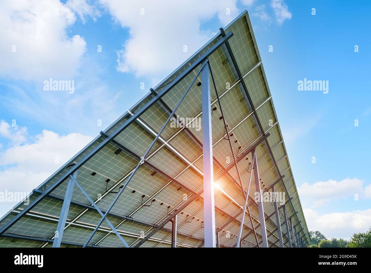 Canopy in the backyard made of solar panels near private house Stock Photo