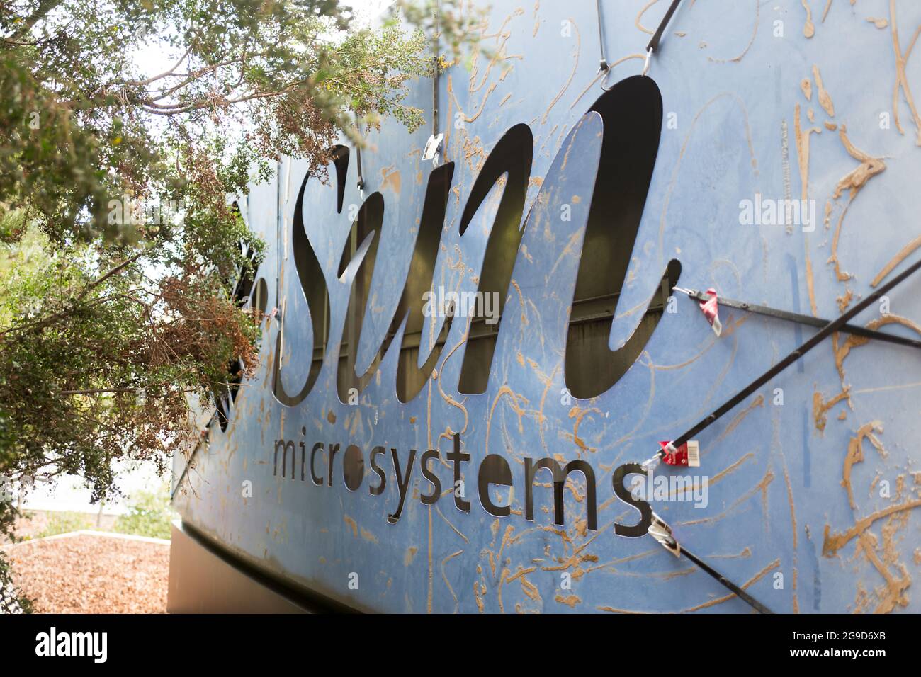 A former sign for the legacy Silicon Valley software company Sun  Microsystems is visible on the back side of the main sign for social  network Facebook, which occupies office space formerly belonging