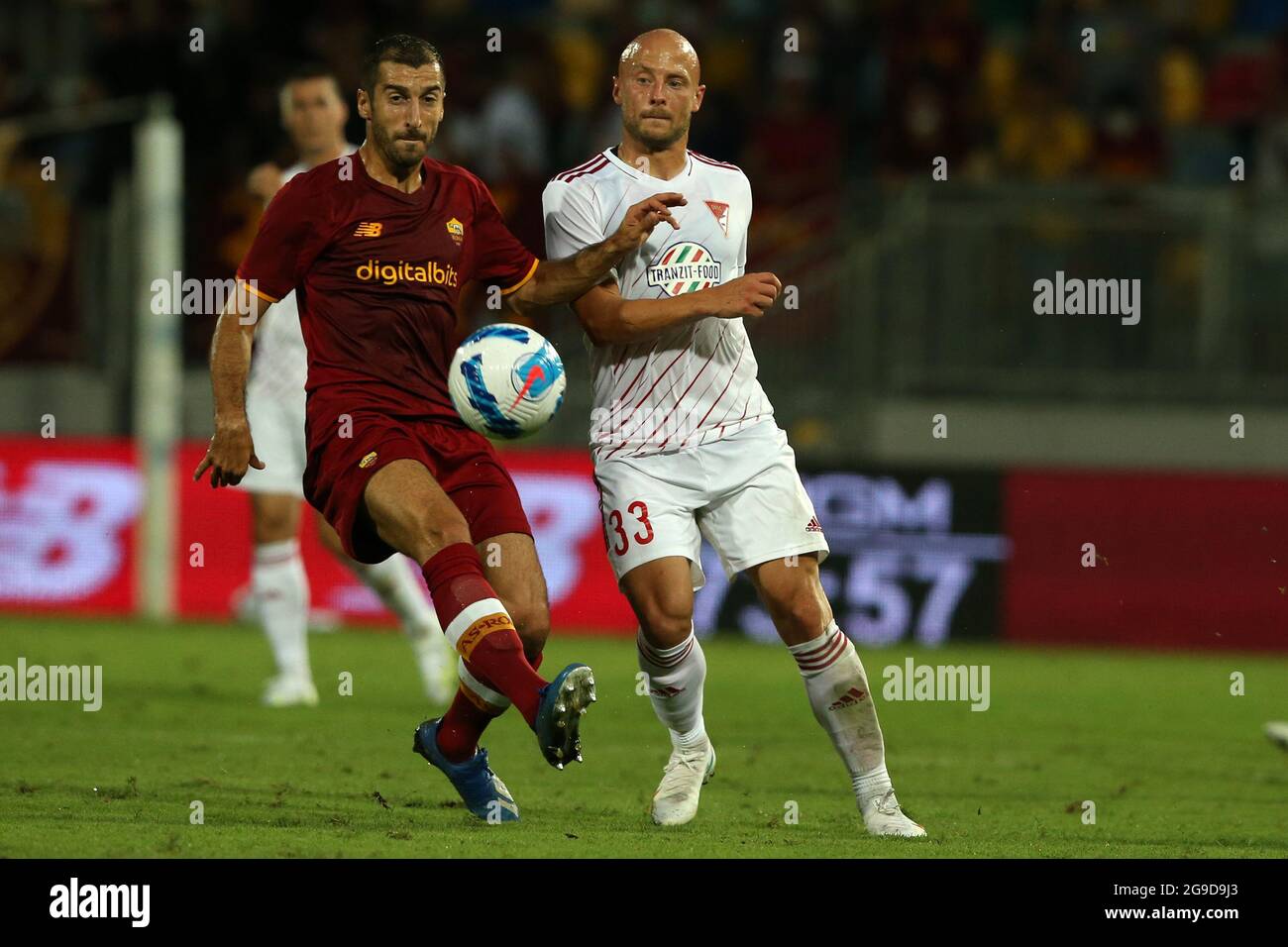 Frosinone, Italy. 25th July, 2021. Frosinone, Italy July 25 2021. Henrix Mkhitaryan (Roma) and Jozsef Varga (Debrecen) compete for the ball during the friendly match between AS Roma and DVSC at Stadio Benito Stirpe. (Photo by Giuseppe Fama/Pacific Press) Credit: Pacific Press Media Production Corp./Alamy Live News Stock Photo