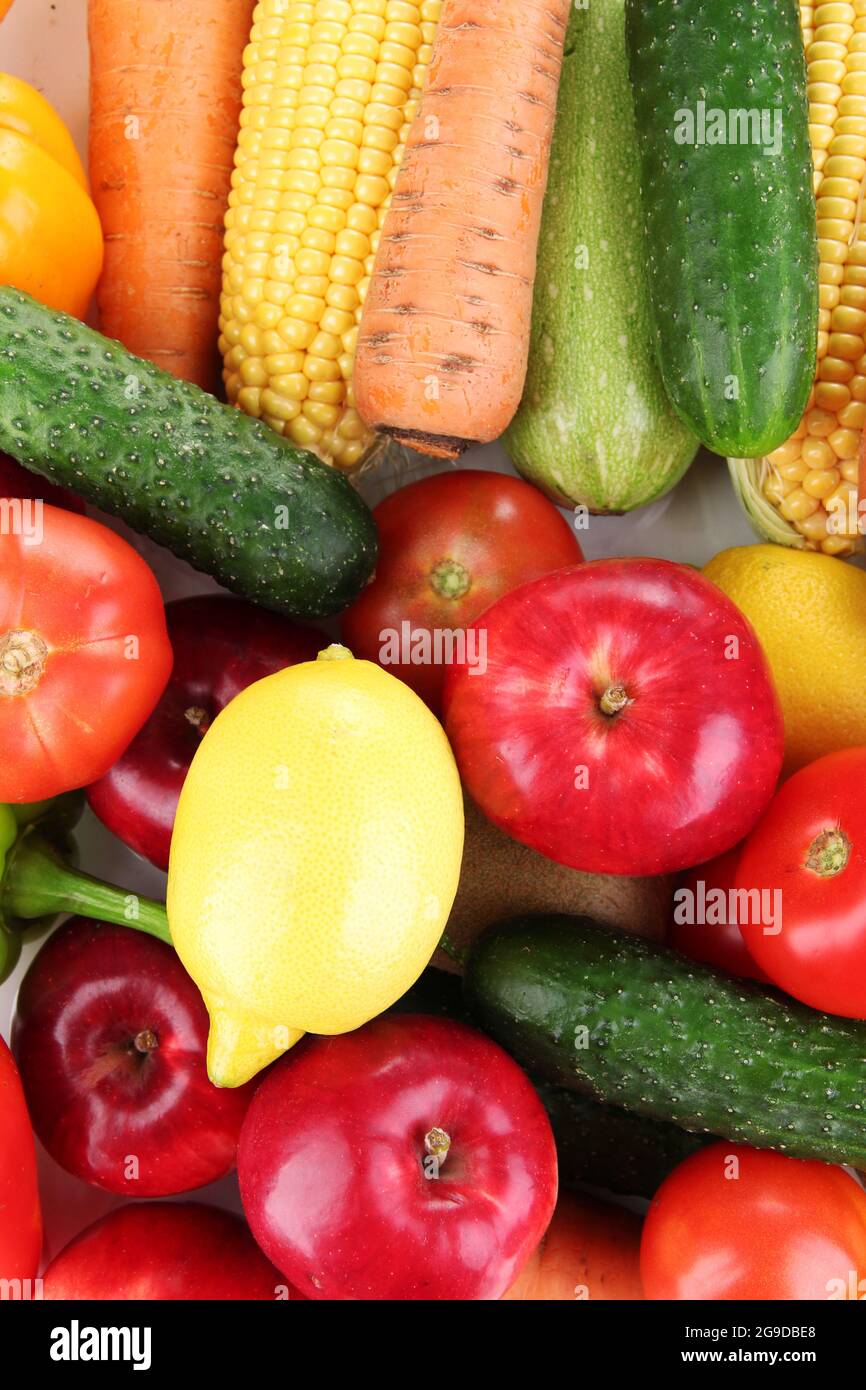Assortment of fresh vegetables and fruits as a background Stock Photo