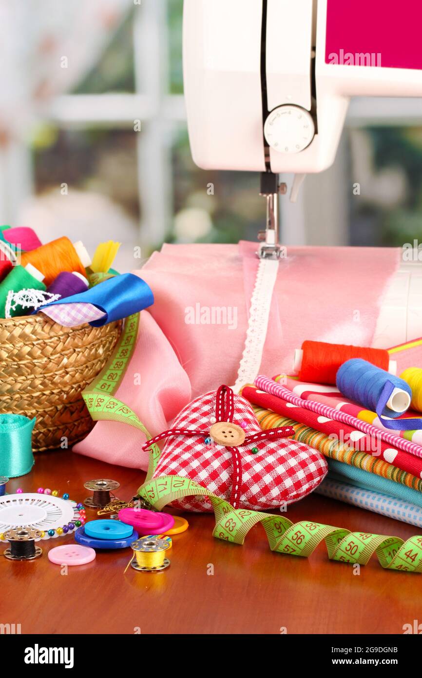 sewing machine and fabric on bright background Stock Photo Alamy