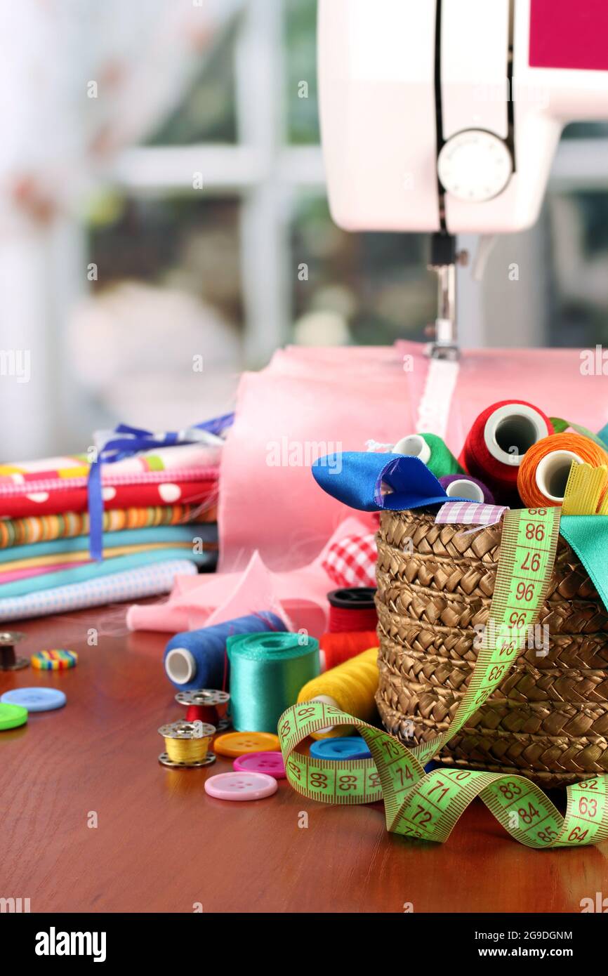 sewing machine and fabric on bright background Stock Photo Alamy