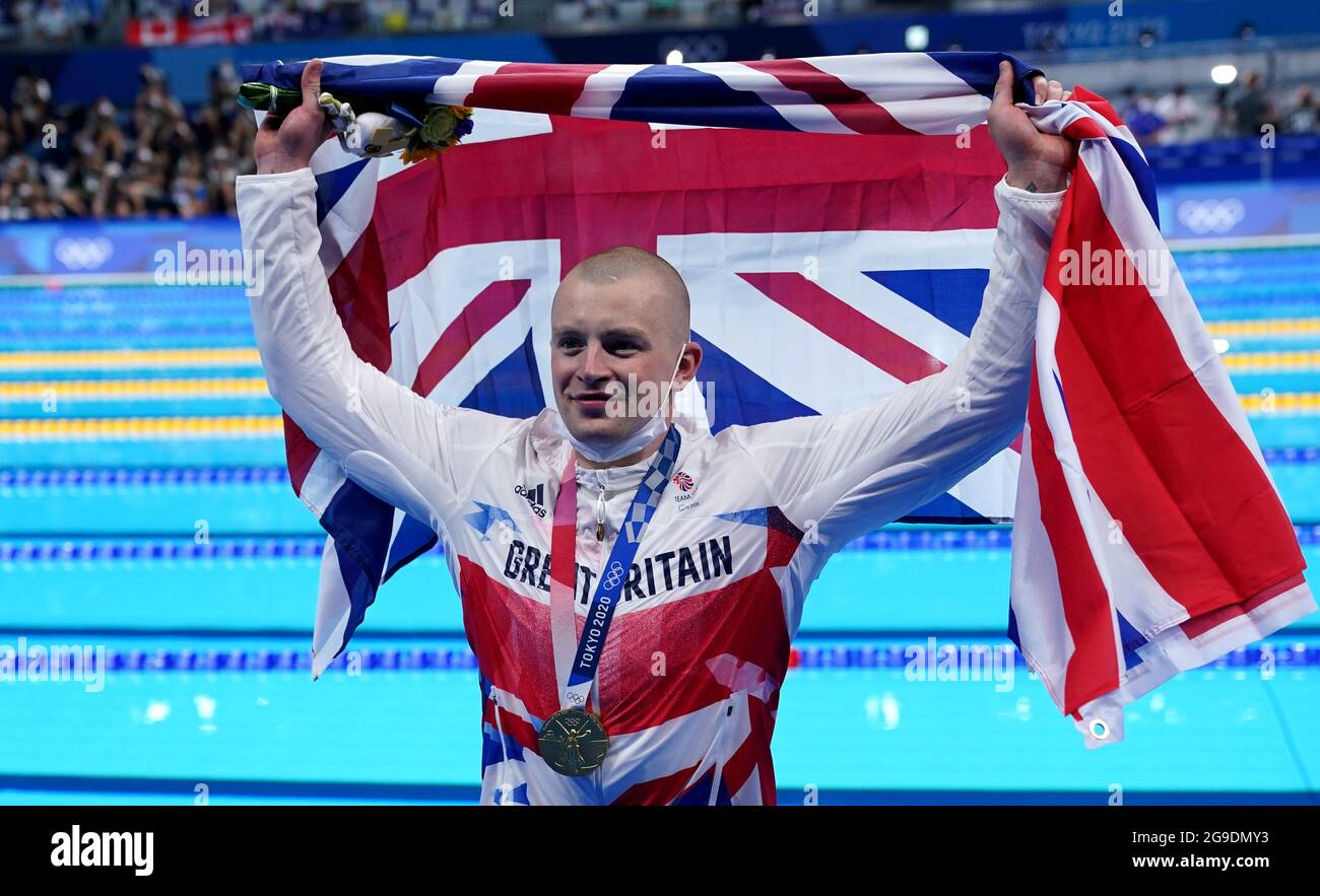 great-britain-s-adam-peaty-poses-with-his-gold-medal-on-the-podium