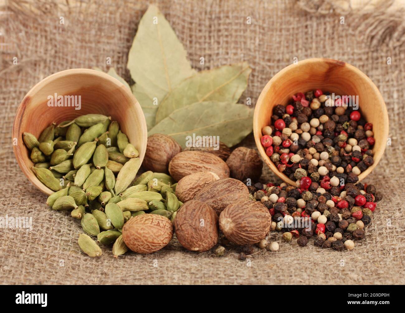 Nutmeg and other spices on sackcloth background Stock Photo Alamy
