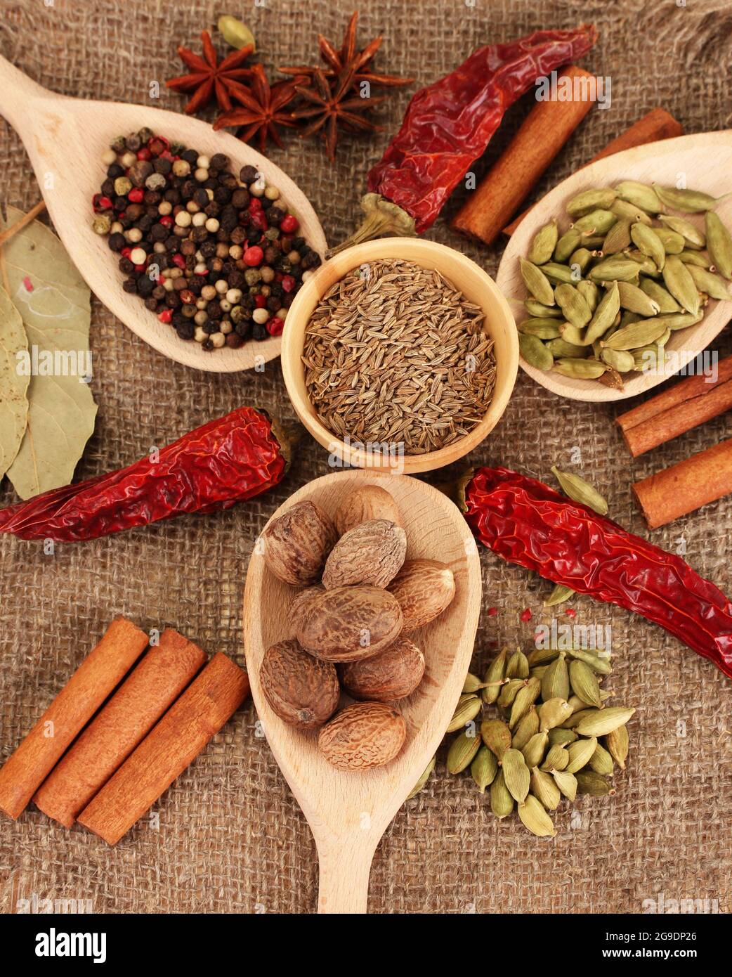 Nutmeg and other spices on sackcloth background Stock Photo Alamy