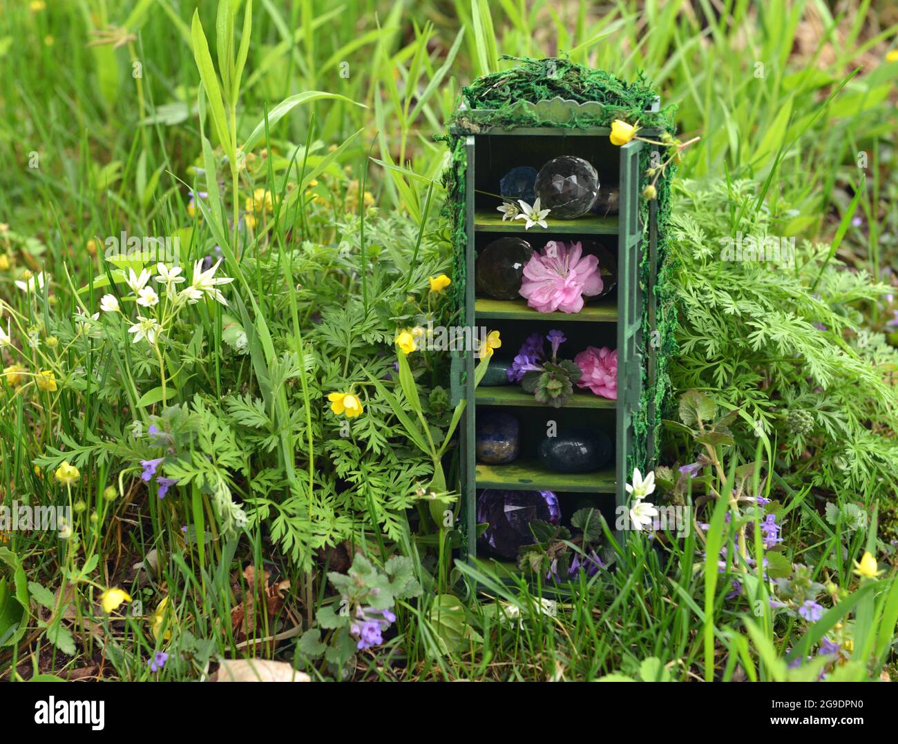 Tiny beautiful wardrobe or closet from dollhouse with magic ogjects of