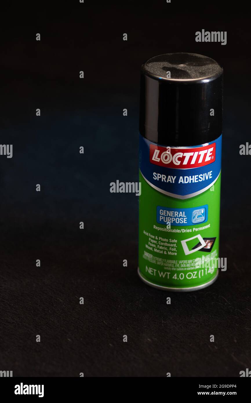Spray can of Loctite Spray Adhesive.  Used to bond lightweight materials together such as fabric, foam, cardboard, corkboard Stock Photo