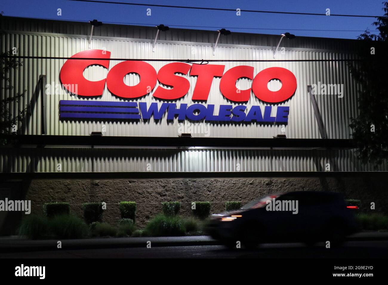 Seattle, United States. 24th July, 2021. A car passes by a Costco store in Seattle. The American big box retailer is opening new locations in the United States and internationally. (Photo by Toby Scott/SOPA Images/Sipa USA) Credit: Sipa USA/Alamy Live News Stock Photo