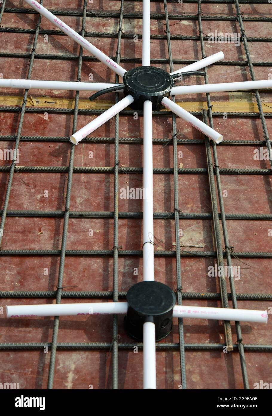 Electric fixture installation during flat construction Stock Photo