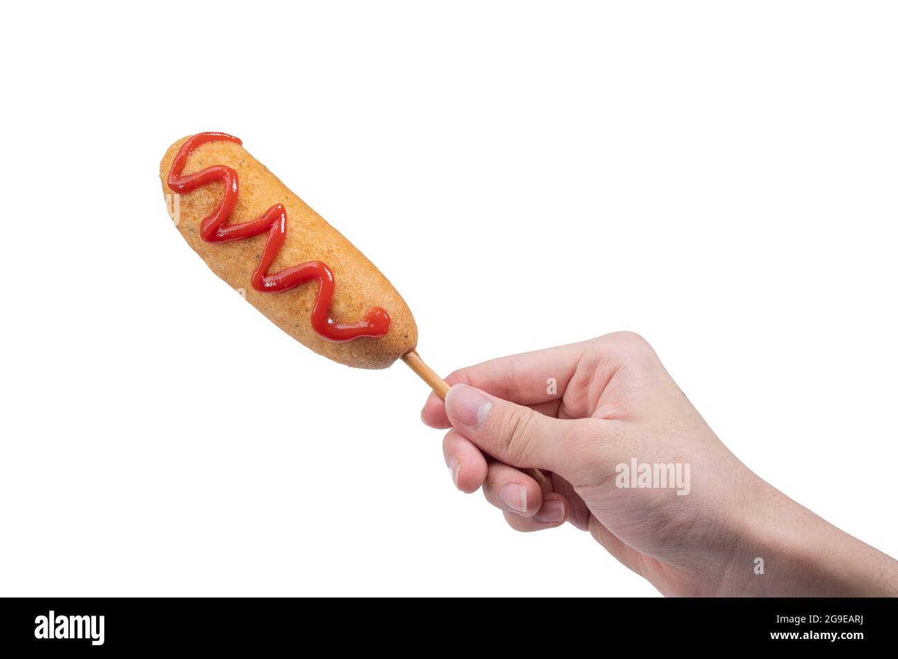 hand holding corn dog isolated on white background Stock Photo