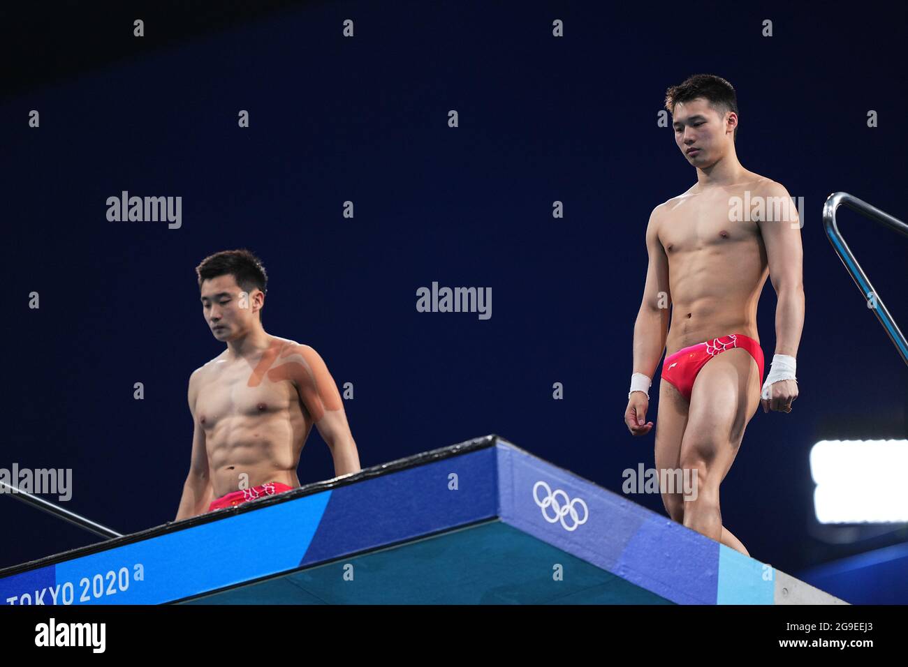 Tokyo, Japan. 26th July, 2021. Cao Yuan and Chen Aisen of China compete during the men's synchronised 10m platform final of diving at Tokyo 2020 Olympic Games in Tokyo, Japan, July 26, 2021. Credit: Xu Chang/Xinhua/Alamy Live News Stock Photo