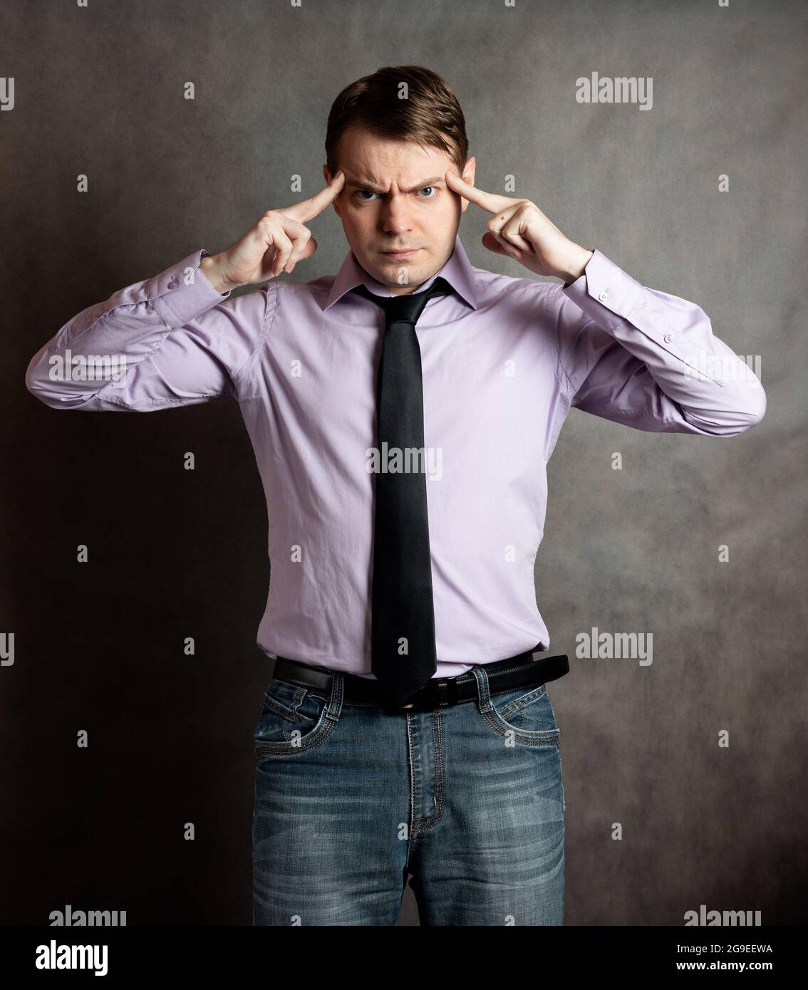 Thoughtful man in pink shirt hi-res stock photography and images - Alamy