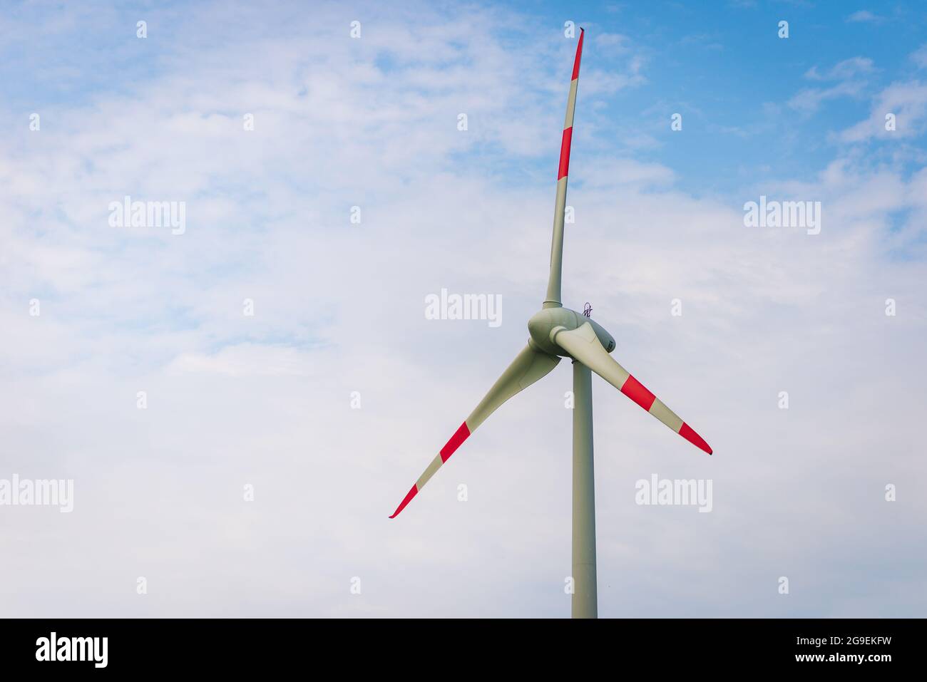 Single windmill generating electricity against blue sky.Beautiful wind ...
