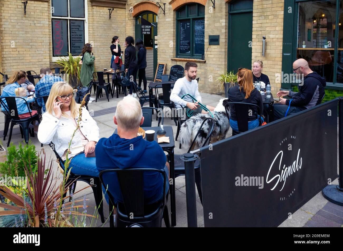 Customers enjoying refreshment outside at Signals Bistro Saltburn by the Sea North Yorkshire England Stock Photo