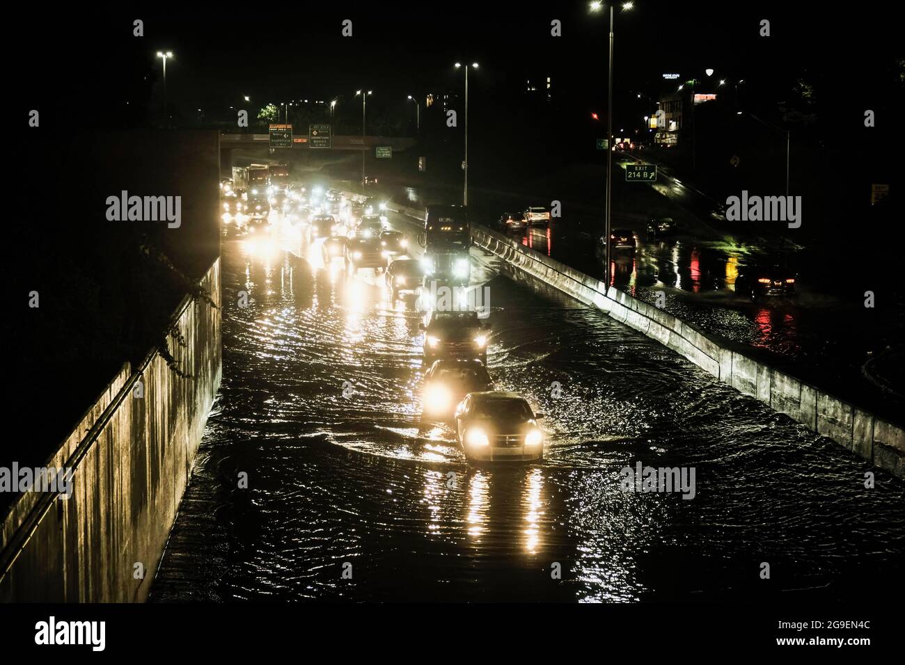 Detroit, United States. 24th July, 2021. Vehicles cautiously drive through floodwaters on I-94 following a severe storm system that caused flash flooding on main roadways in Detroit. Severe storms across South East Michigan caused major damage and significant flooding in parts of Detroit and surrounding areas for the third time in a month. Multiple highways were shut down due to floodwaters and residents reported a tornado damaging part of Armada, Michigan. Credit: SOPA Images Limited/Alamy Live News Stock Photo