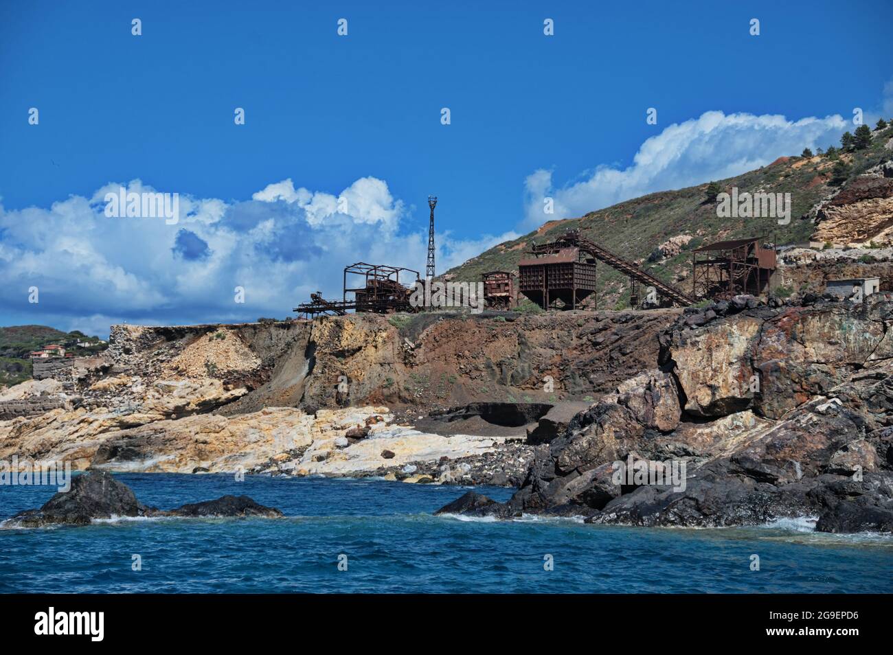 Old iron ore mine on the rocks of Elba island Stock Photo