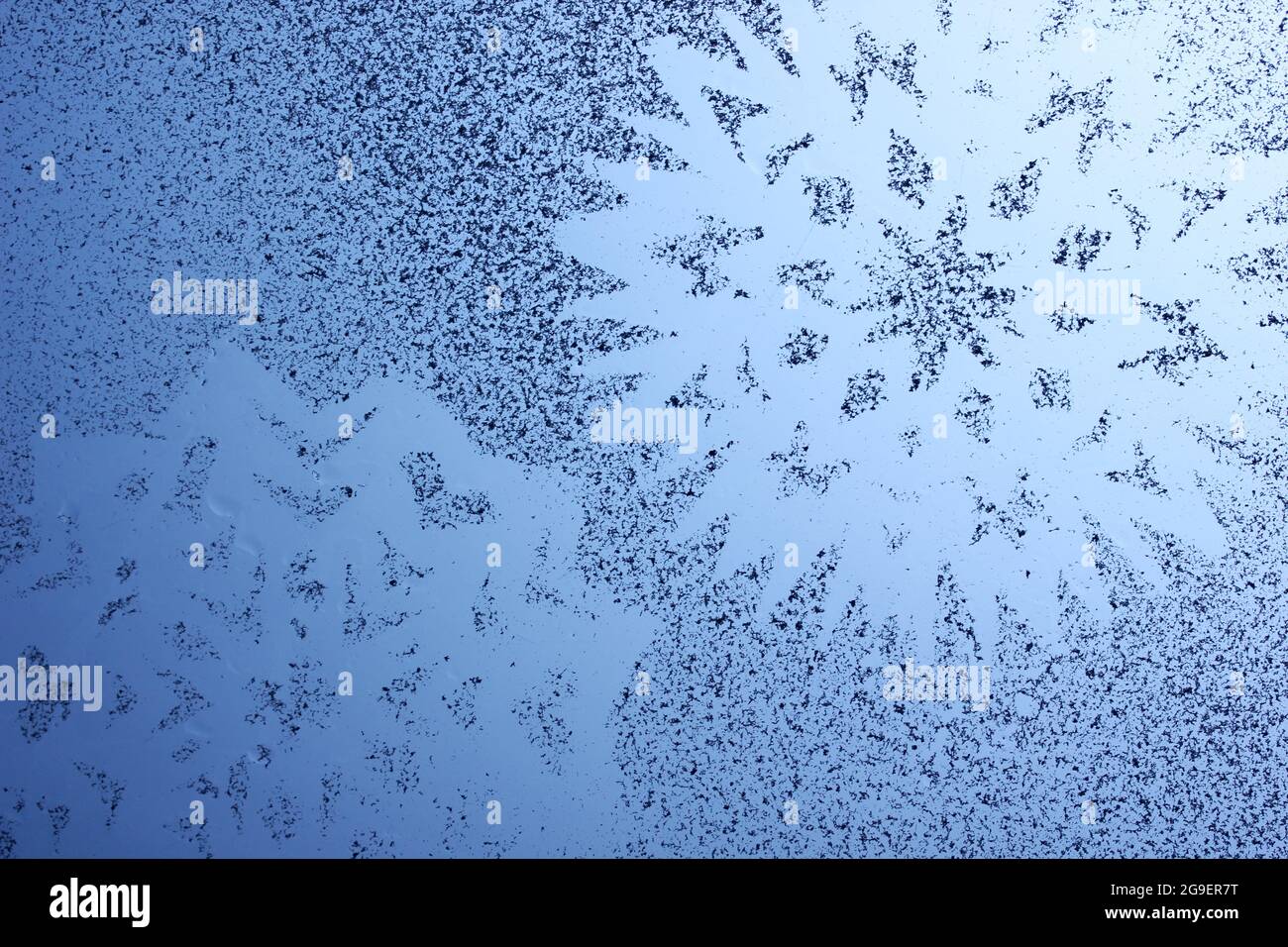 Snowflake pattern on window Stock Photo - Alamy