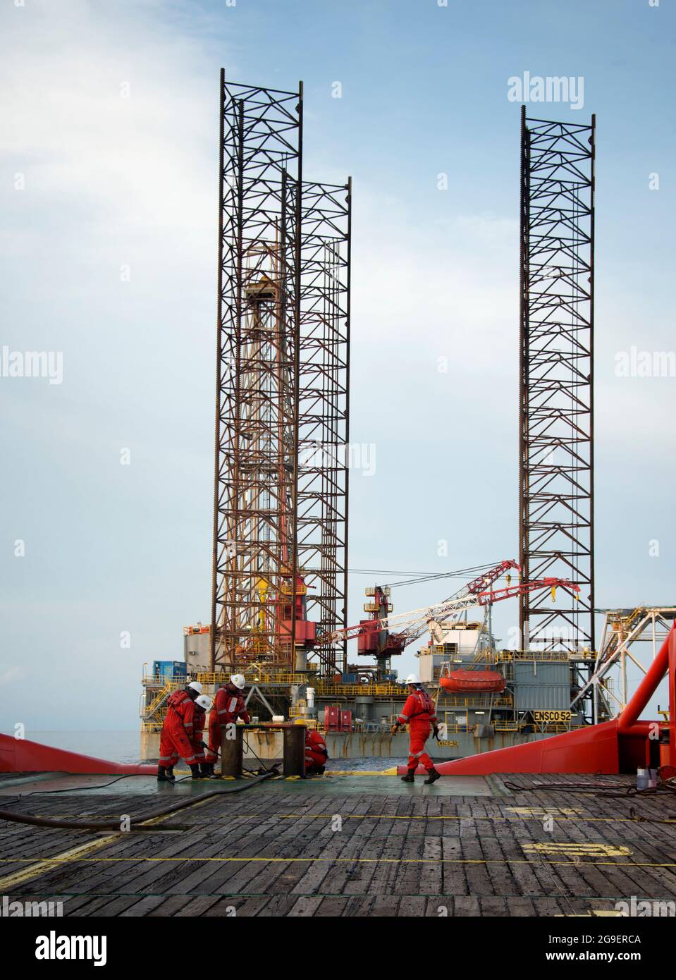 marine crew working on deck during cargo handling operation for jack up