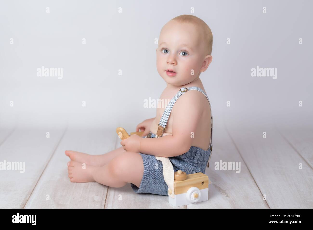 little boy with old photographic camera on white background Stock Photo