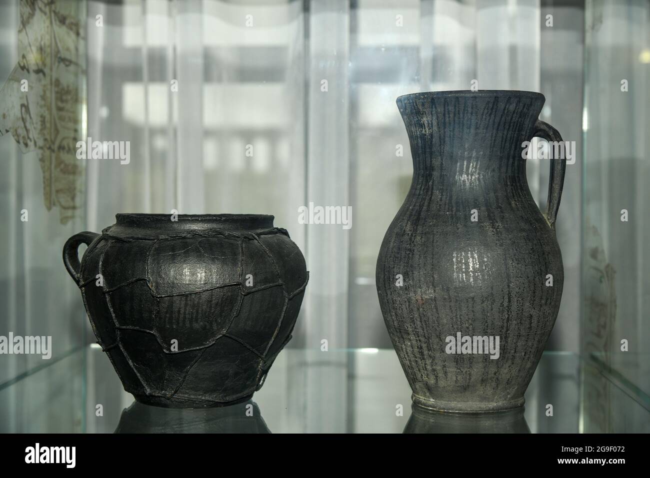 Ancient black ceramic jugs with patterns Stock Photo - Alamy