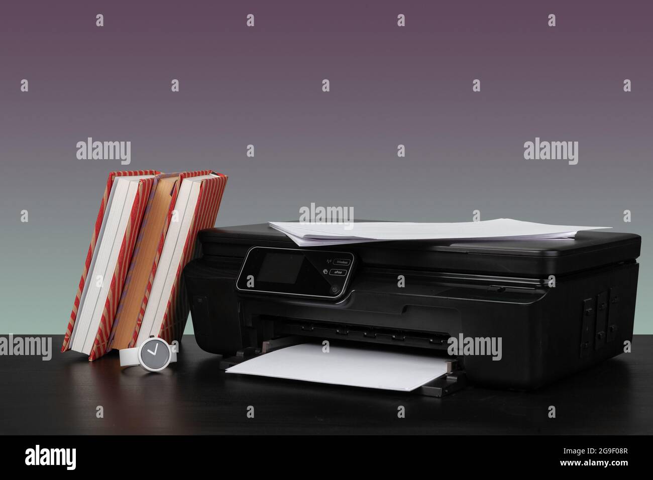 Compact home laser printer against gray background Stock Photo