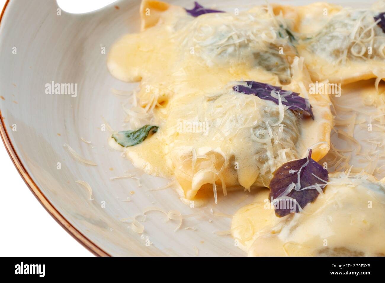 Italian dish ravioli in plate isolated on white background Stock Photo