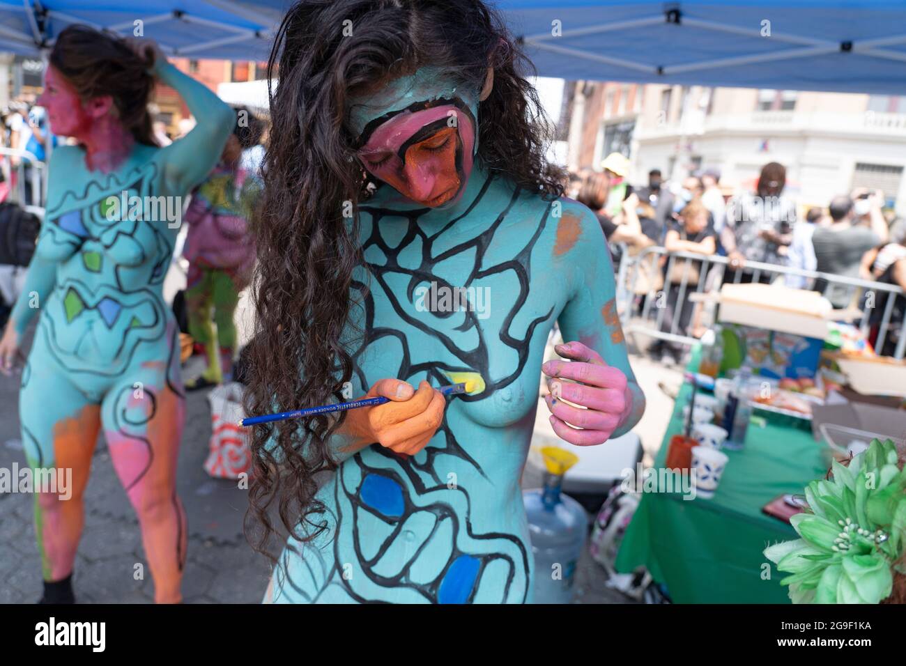 NEW YORK, NEW YORK - JULY 25: (EDITOR'S NOTE: Image Contains Nudity) Model  Shira paints herself during the 8th annual 'NYC Body Painting Day' in Union  Square on July 25, 2021 in