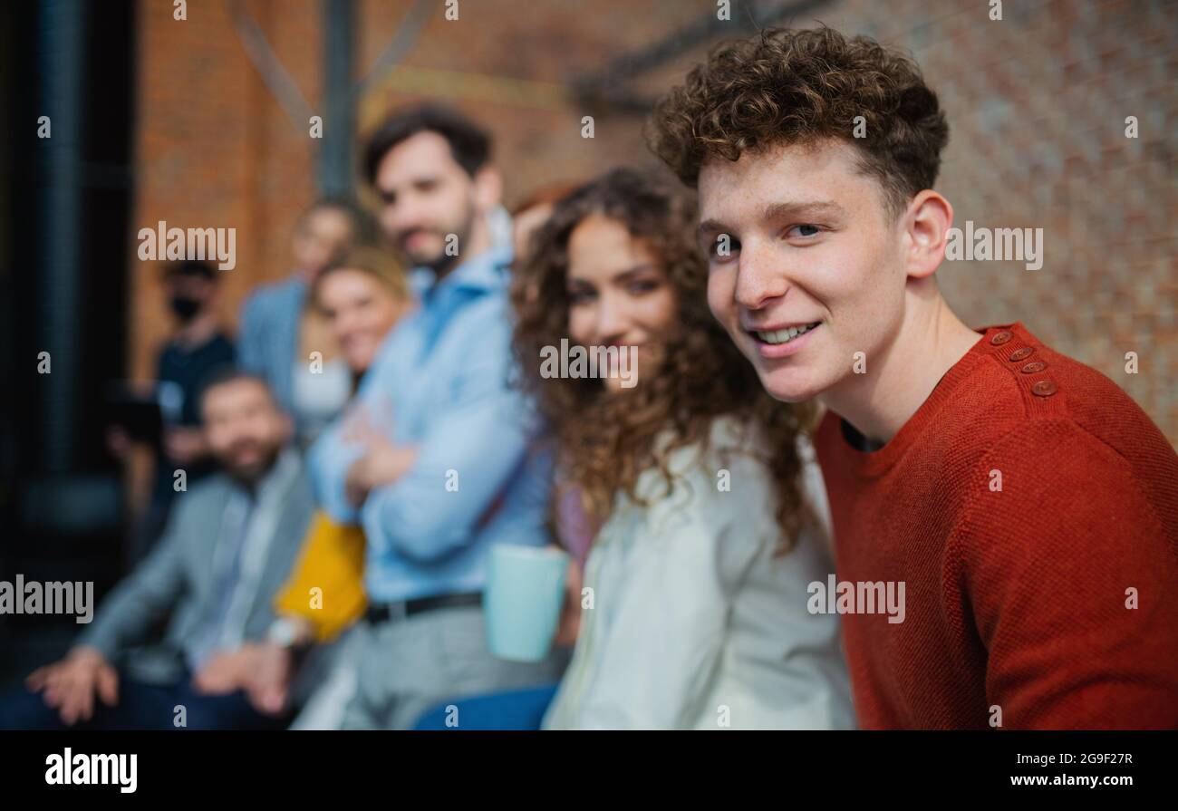 Portrait of businesspeople entrepreneurs indoors in office, looking at camera. Stock Photo
