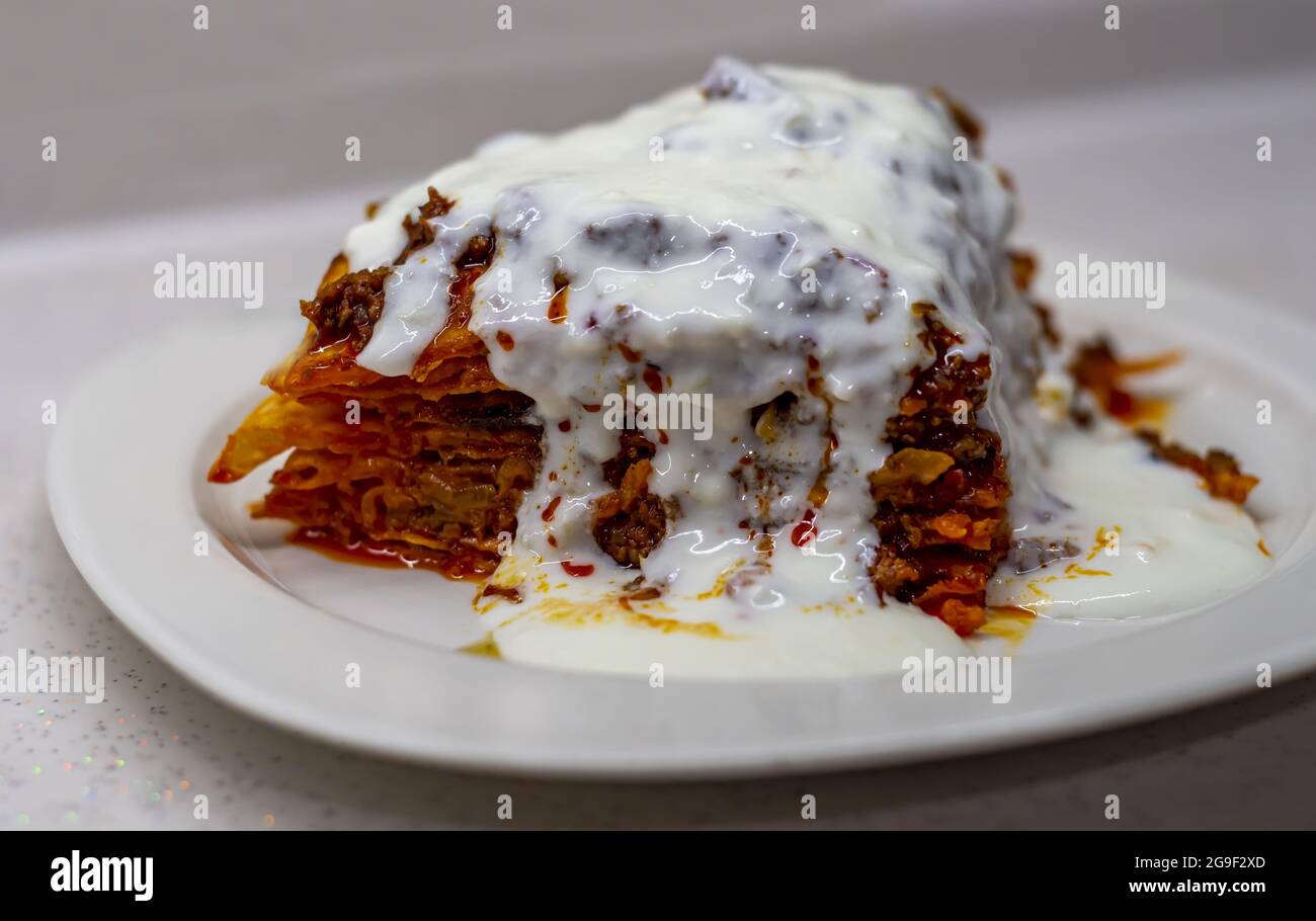 closeup of traditional turkish food kayseri yalama with minced meat yogurt and tomato paste stock photo alamy