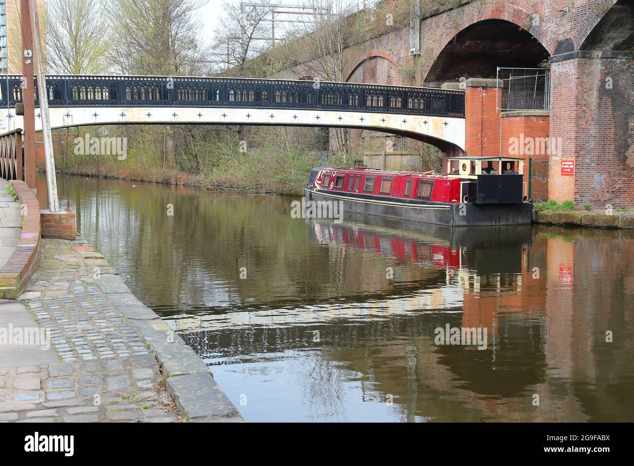 Manchester canals, UK. Historic Castlefield district, waterway canal area with narrowboats. Stock Photo