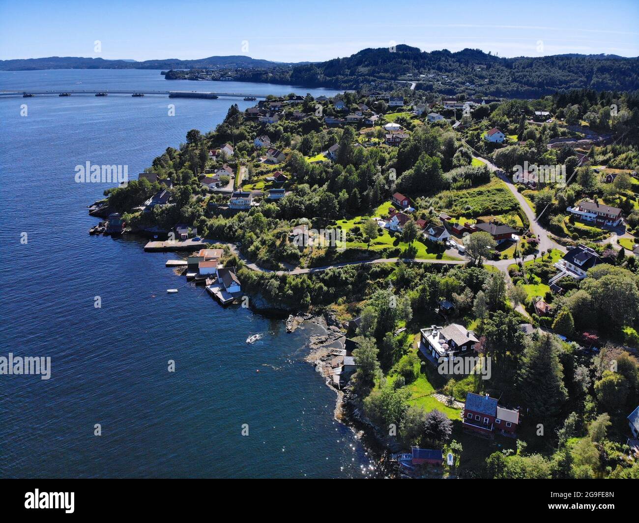 Norway drone view. Krossneset village in Alver municipality. Flatoy island and Salhusfjorden fjord. Holsnoy island in background. Stock Photo