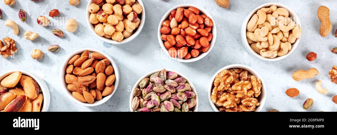 Nut assortment panoramic header. Healthy vegan snack banner with ...