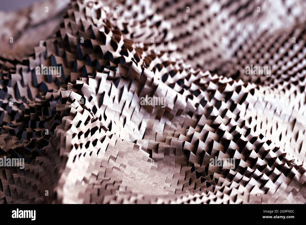 Abstract background with perforated wrapping paper Stock Photo - Alamy