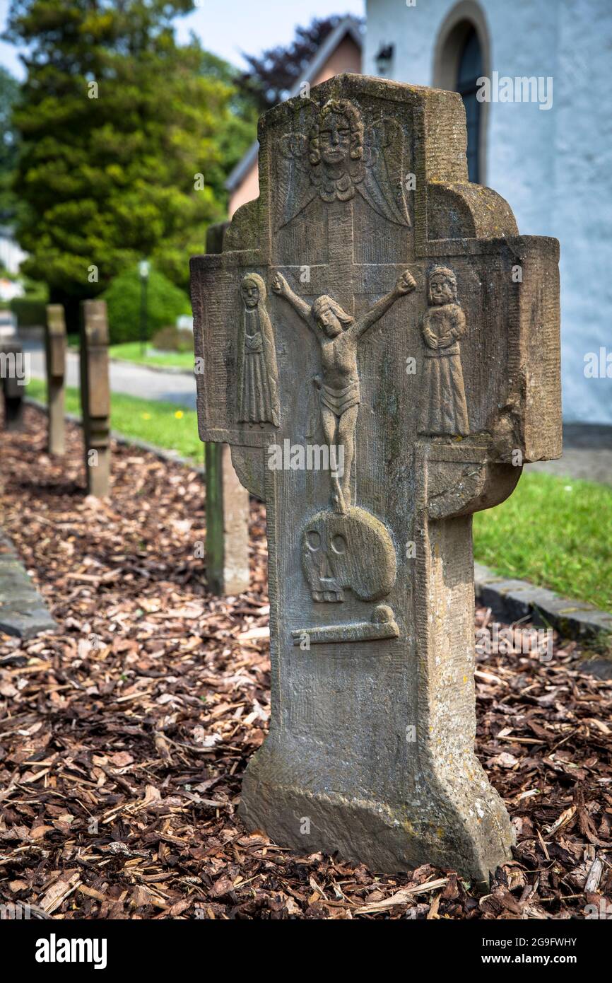 tombstone on the cemetery at the romanesque St. George church in Troisdorf-Altenrath, Troisdorf, North Rhine-Westphalia, Germany.  Grabstein auf dem F Stock Photo