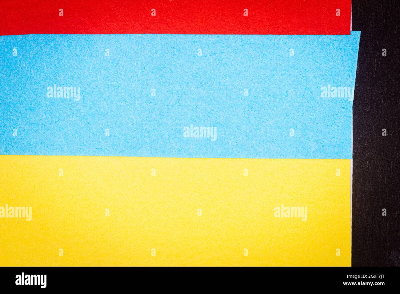 Multicolor background from a paper of different colors. Abstract ...