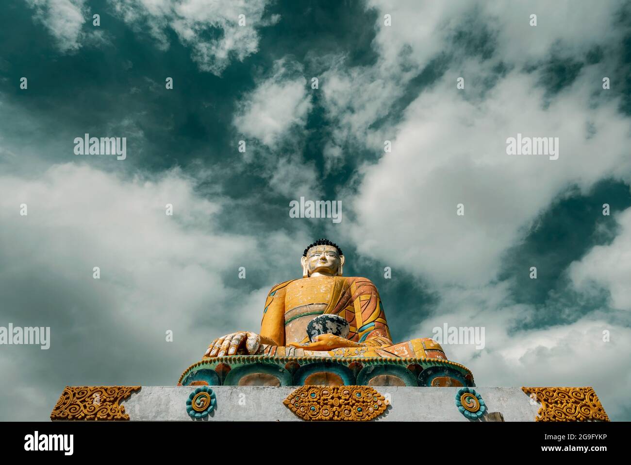 Landscape photograph of statue of Lord Buddha under blue sky and white ...