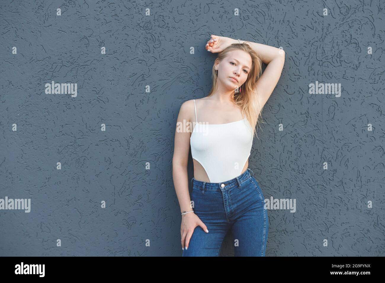 Pretty blonde woman in jeans hi-res stock photography and images - Alamy