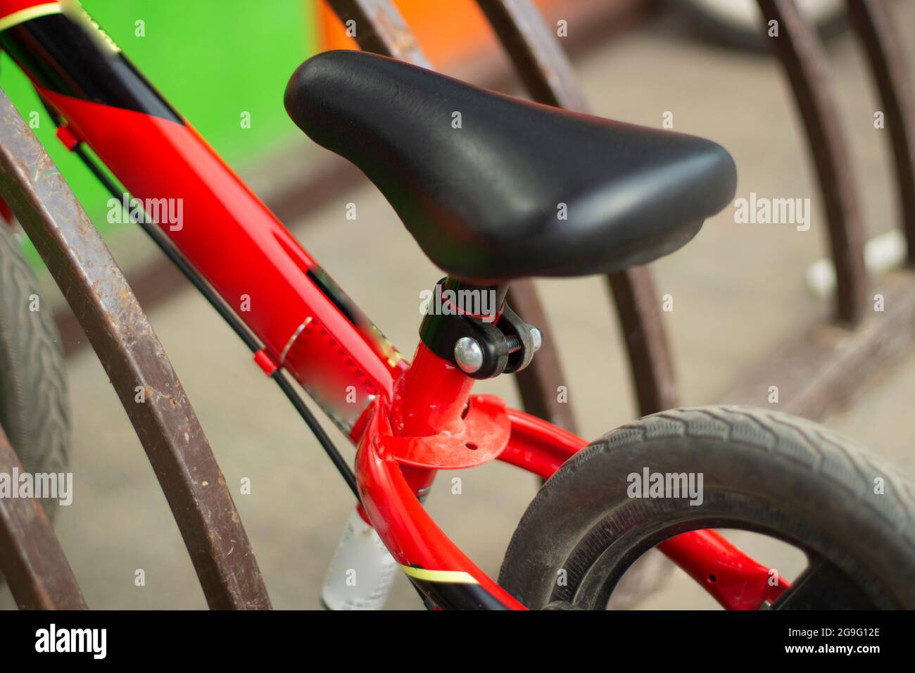 Children's bike in the bicycle parking. Bicycle without pedals