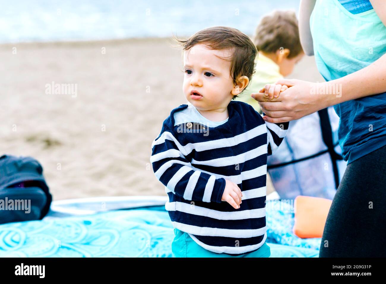 portrait of one year old baby on the beach in summer afternoon Stock Photo