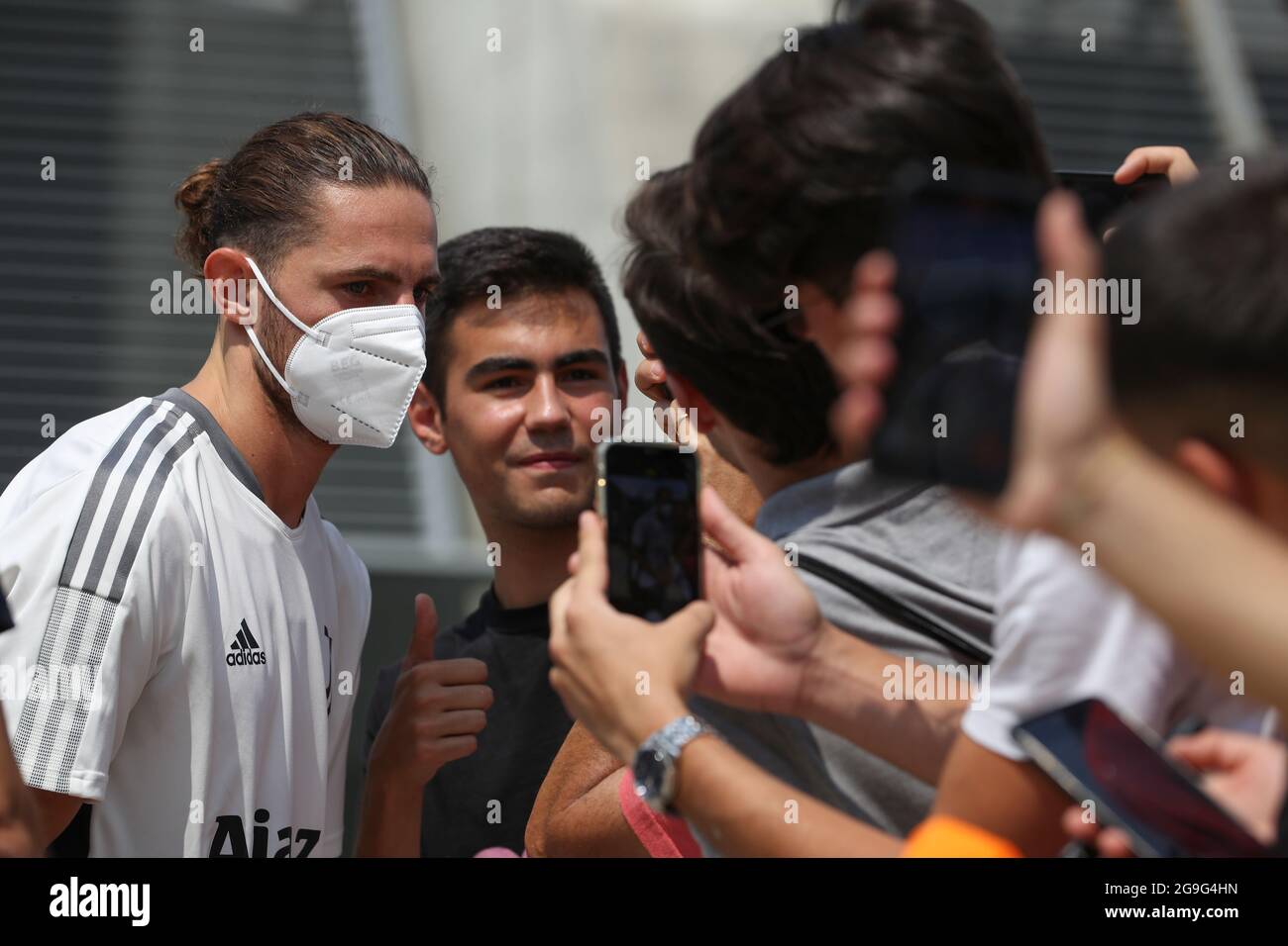 Adrien Rabiot of Juventus signs autographs and poses for photos as he ...